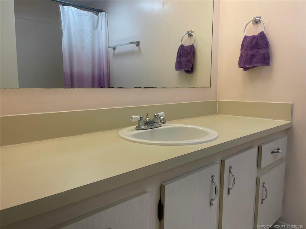 1270 Southeast Parkview Place, Unit B3 Stuart, FL 34994 - Photo 22 of 40 a bathroom with a sink and a mirror