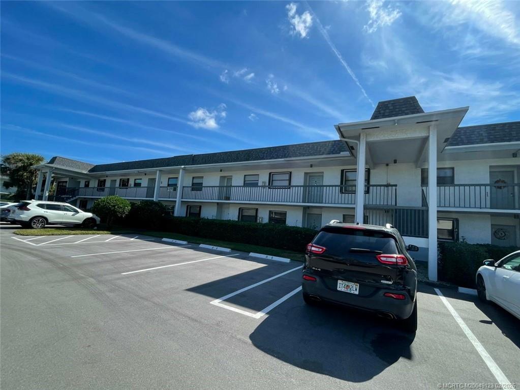 1270 Southeast Parkview Place, Unit B3 Stuart, FL 34994 - Photo 27 of 40 a car parked in front of a building