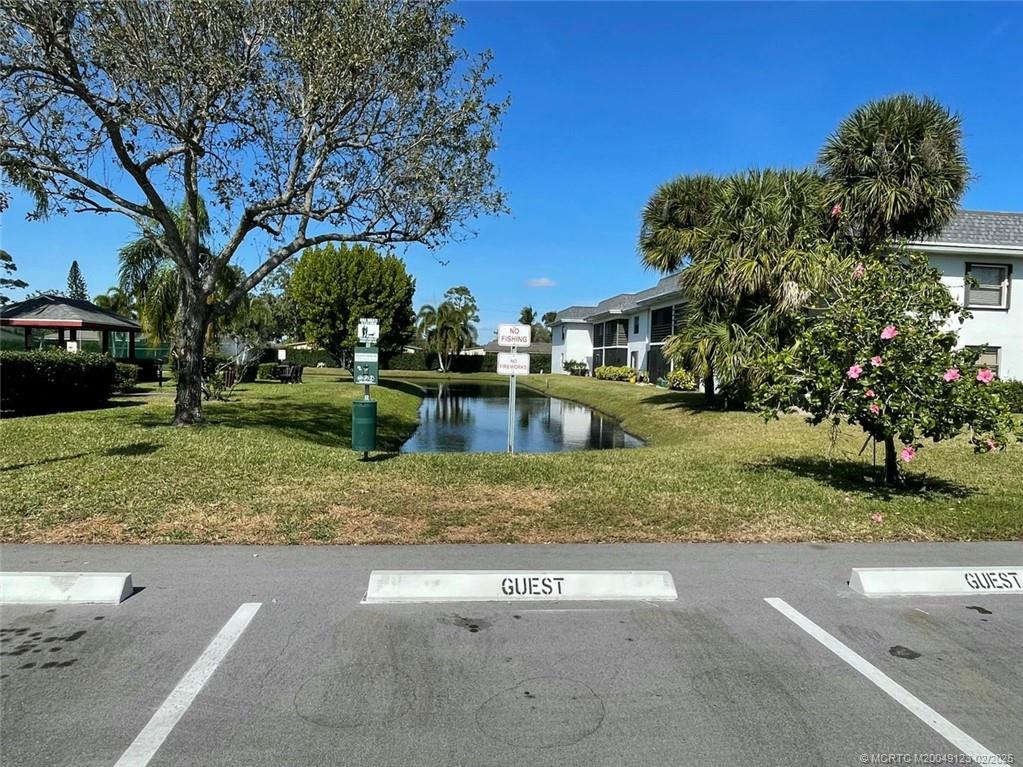 1270 Southeast Parkview Place, Unit B3 Stuart, FL 34994 - Photo 29 of 40 a view of a yard in front of a house