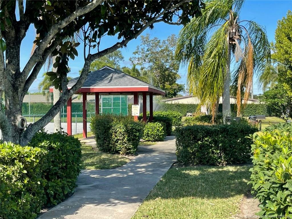 1270 Southeast Parkview Place, Unit B3 Stuart, FL 34994 - Photo 30 of 40 a view of a garden with a patio
