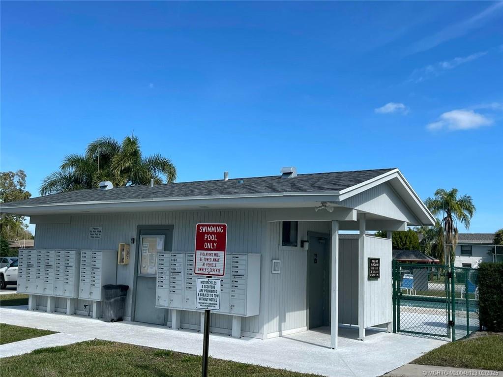 1270 Southeast Parkview Place, Unit B3 Stuart, FL 34994 - Photo 34 of 40 a front view of a house with a yard