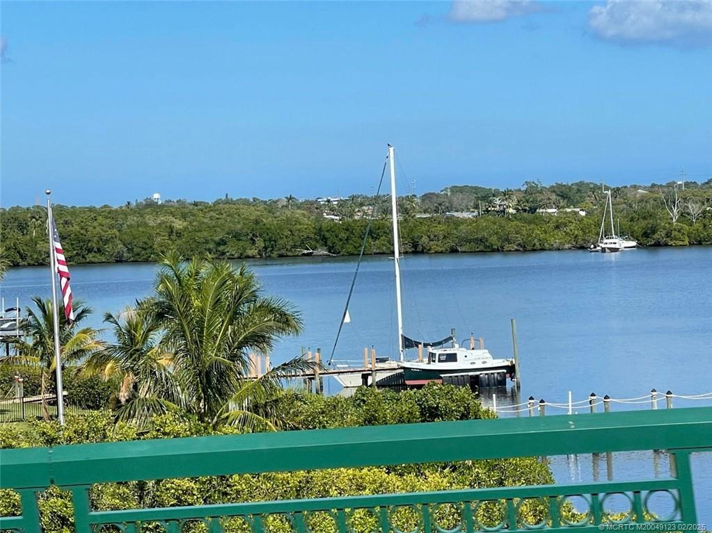 1270 Southeast Parkview Place, Unit B3 Stuart, FL 34994 - Photo 38 of 40 a view of a lake with a mountain in the background