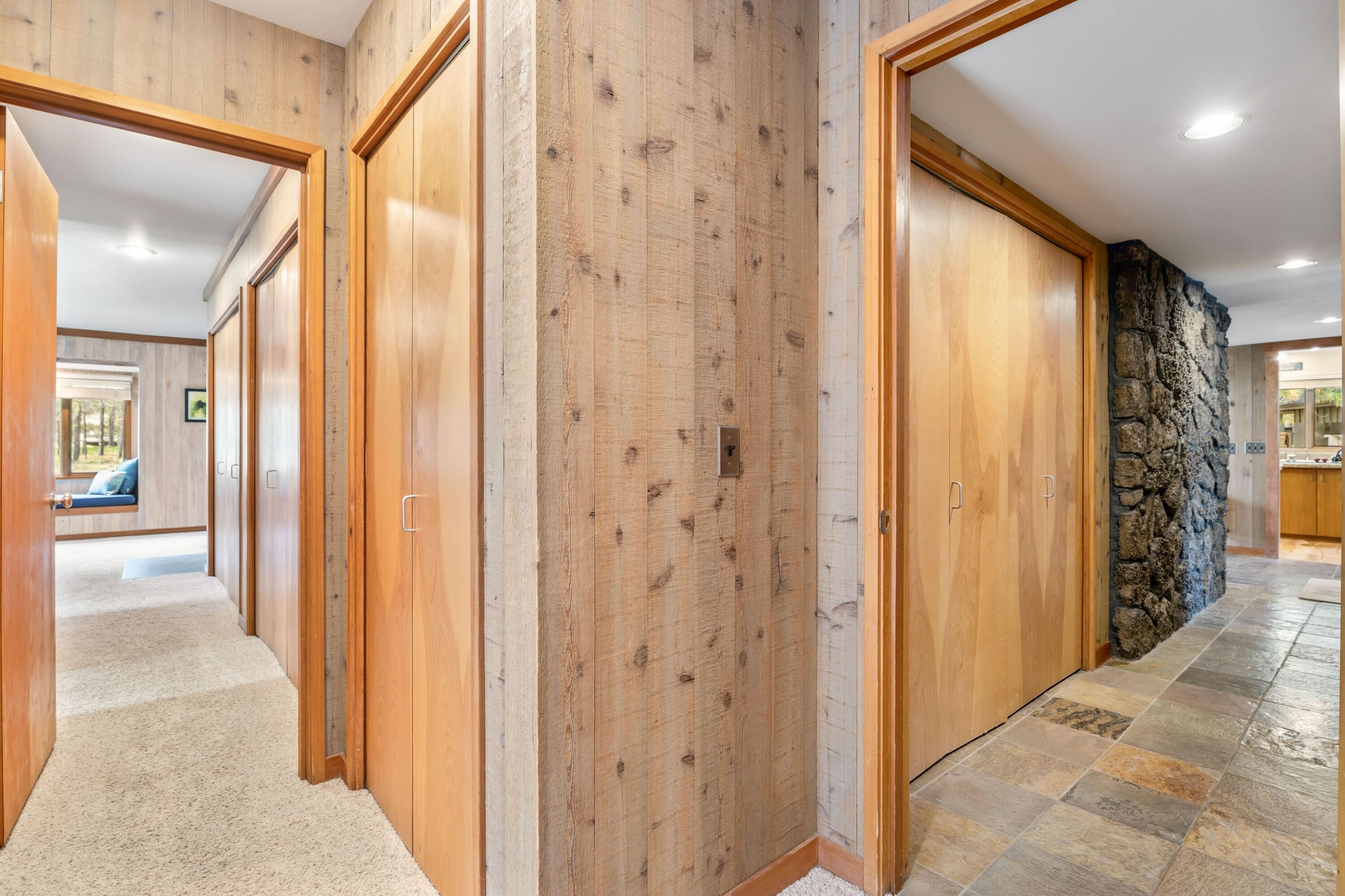 17866 Grouse Lane, Unit 3 Sunriver, OR 97707 - Photo 32 of 61 a view of a hallway with wooden floor and staircase