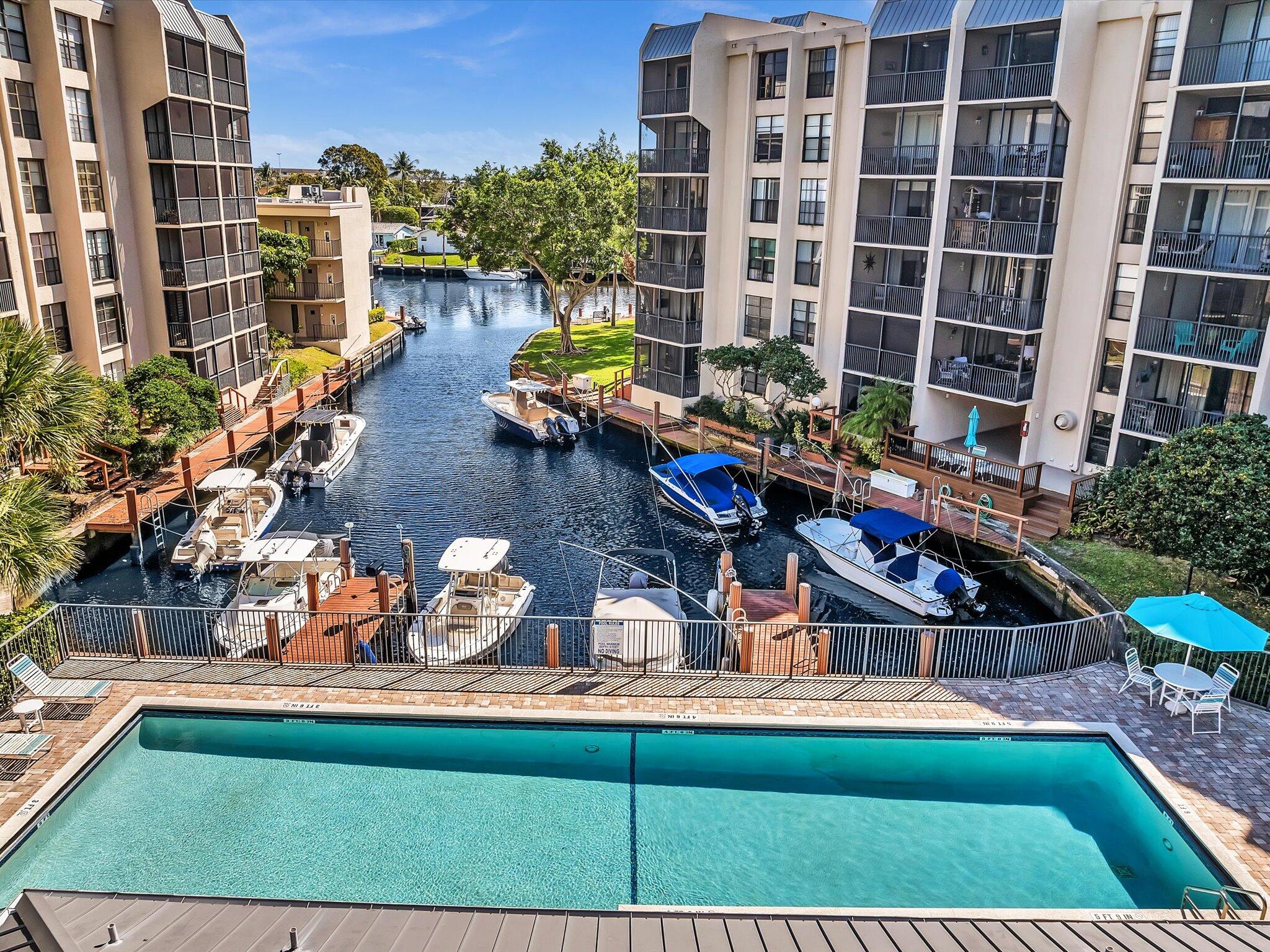 21 Royal Palm Way, Unit 3030 Boca Raton, FL 33432 - Photo 2 of 24 a view of swimming pool with outdoor seating and a potted plant