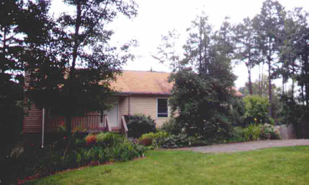 815 Geranium Road Ruckersville, VA 22968 - Photo 1 of 1 a view of a house with a tree and a yard