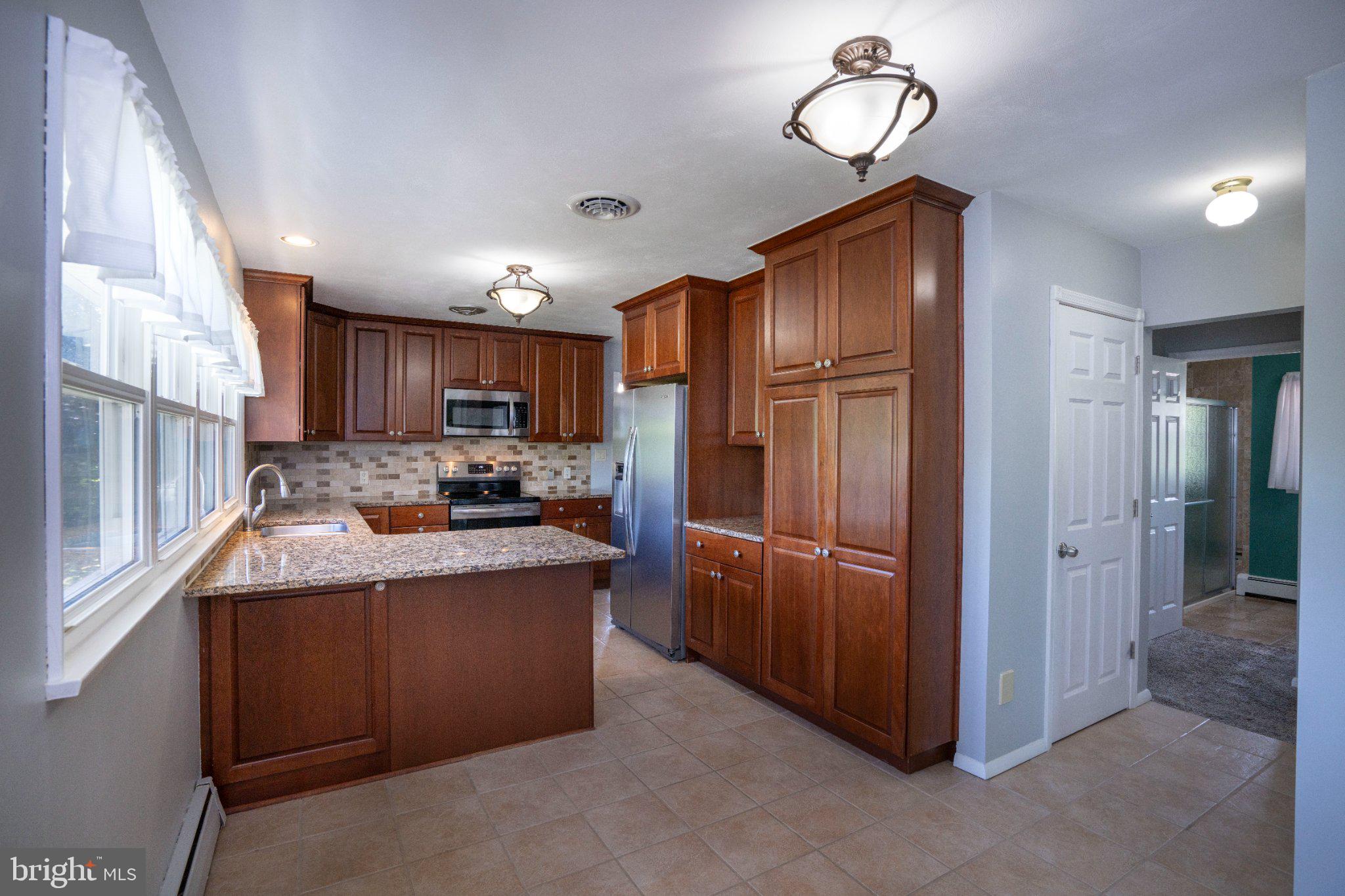 1639 Houserville Road State College, PA 16801 - Photo 20 of 54 Modern kitchen with warm wood tones.