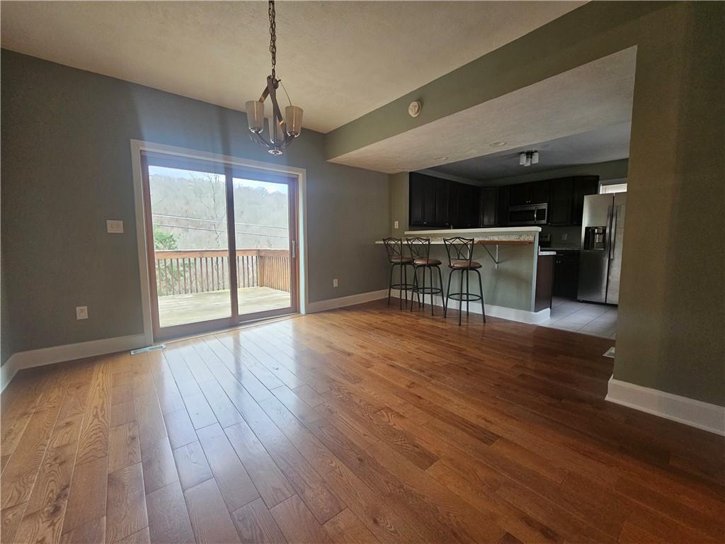 Large dining area exiting to deck for outdoor living.