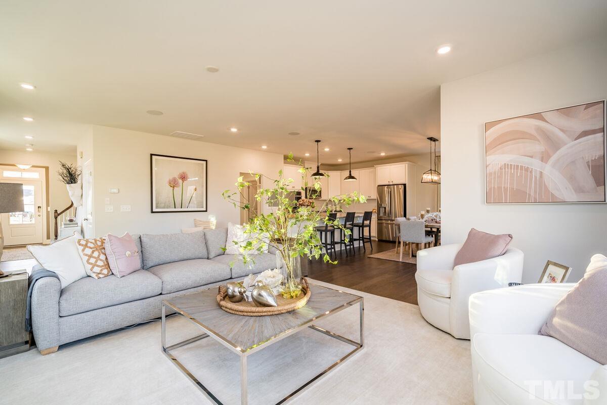 2201 Goudy Drive Raleigh, NC 27615 - Photo 11 of 24 a living room with furniture and wooden floor
