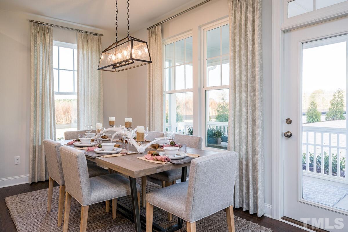 2201 Goudy Drive Raleigh, NC 27615 - Photo 13 of 24 a view of a dining room with furniture window and outside view