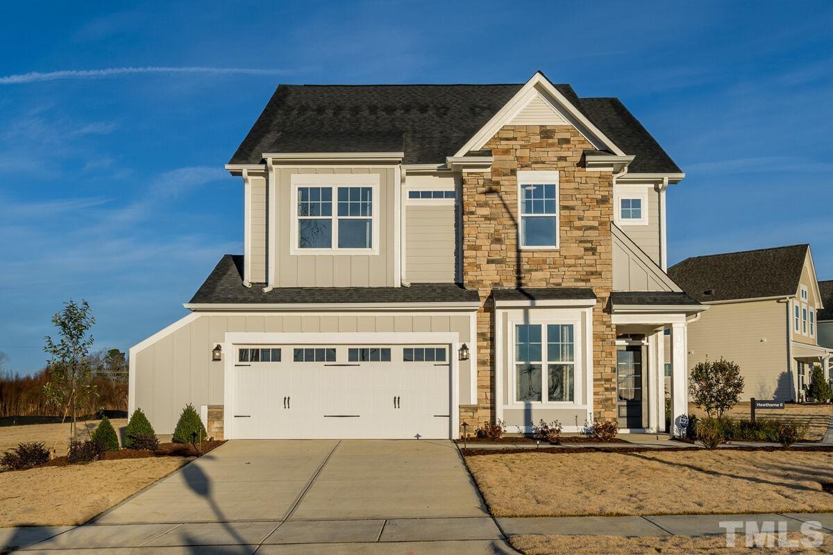 2201 Goudy Drive Raleigh, NC 27615 - Photo 3 of 24 a front view of a house with a yard