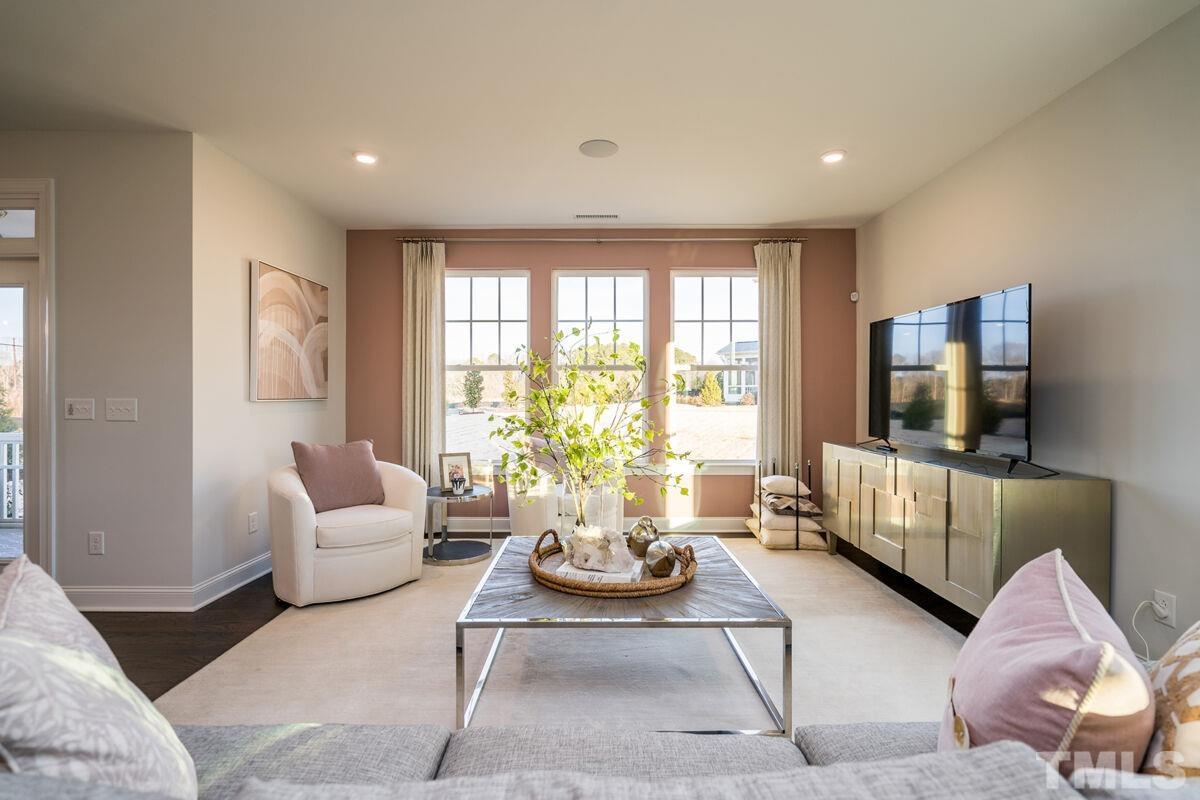 2201 Goudy Drive Raleigh, NC 27615 - Photo 9 of 24 a living room with furniture and a flat screen tv