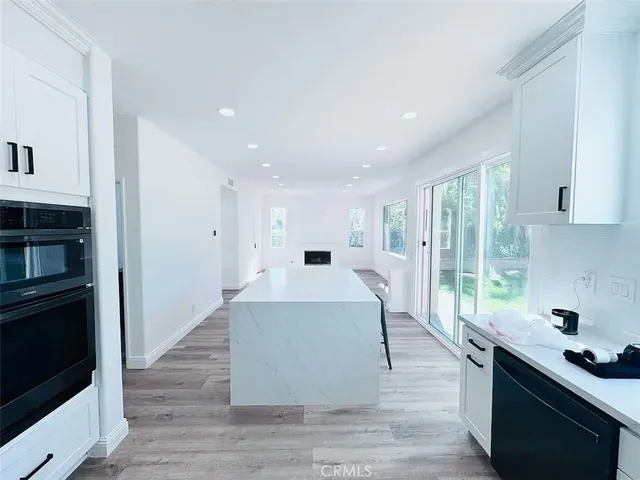 a very nice looking living room with a large window