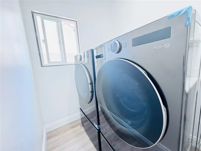 a bathroom with a bathtub and a window