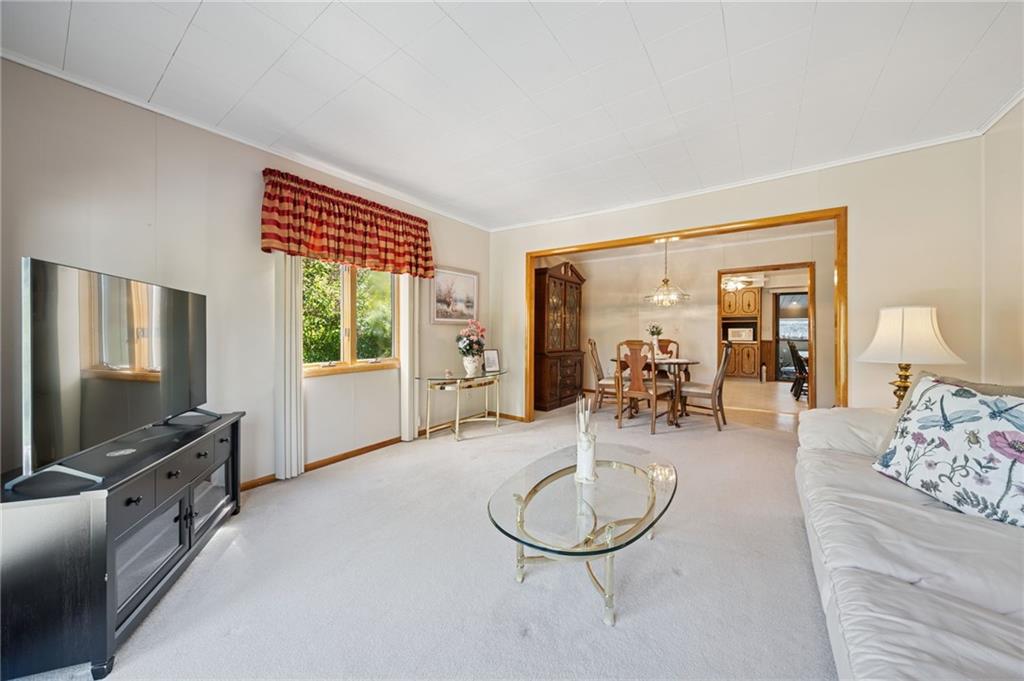 19 Hoon Street Monongahela, PA 15063 - Photo 13 of 37 a living room with furniture a flat screen tv and a large window