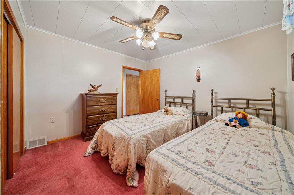 19 Hoon Street Monongahela, PA 15063 - Photo 19 of 37 a bedroom with two beds and a chandelier