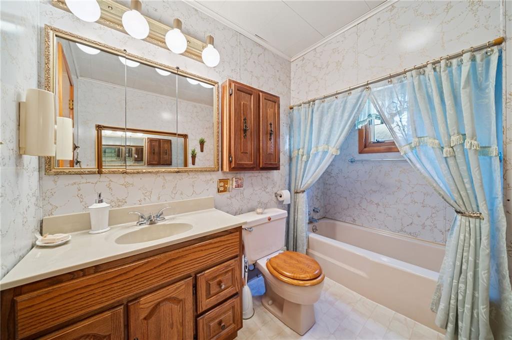 19 Hoon Street Monongahela, PA 15063 - Photo 21 of 37 a bathroom with a sink a toilet and bathtub