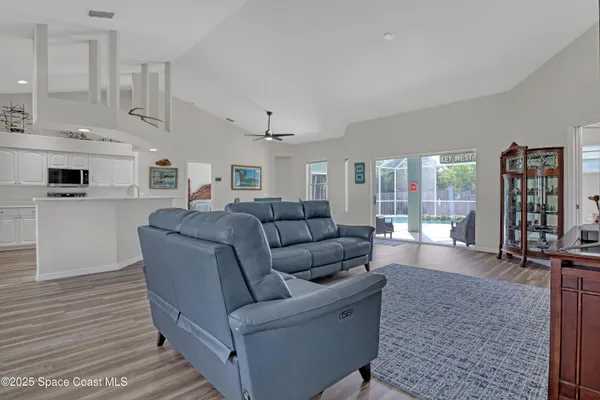 a bedroom with a bed and a couch