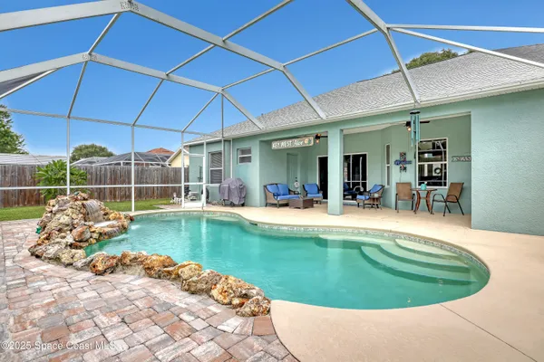 a view of a swimming pool with a lounge chairs