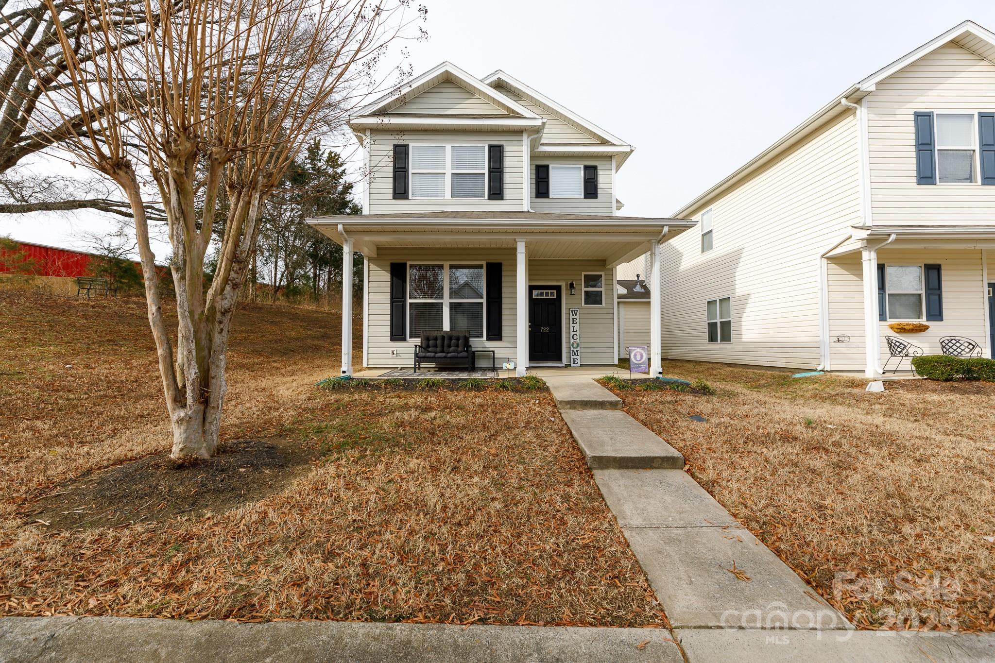 722 Chelton Lane Fort Mill, SC 29715 - Photo 1 of 19 a view of a white house with large windows and wooden fence