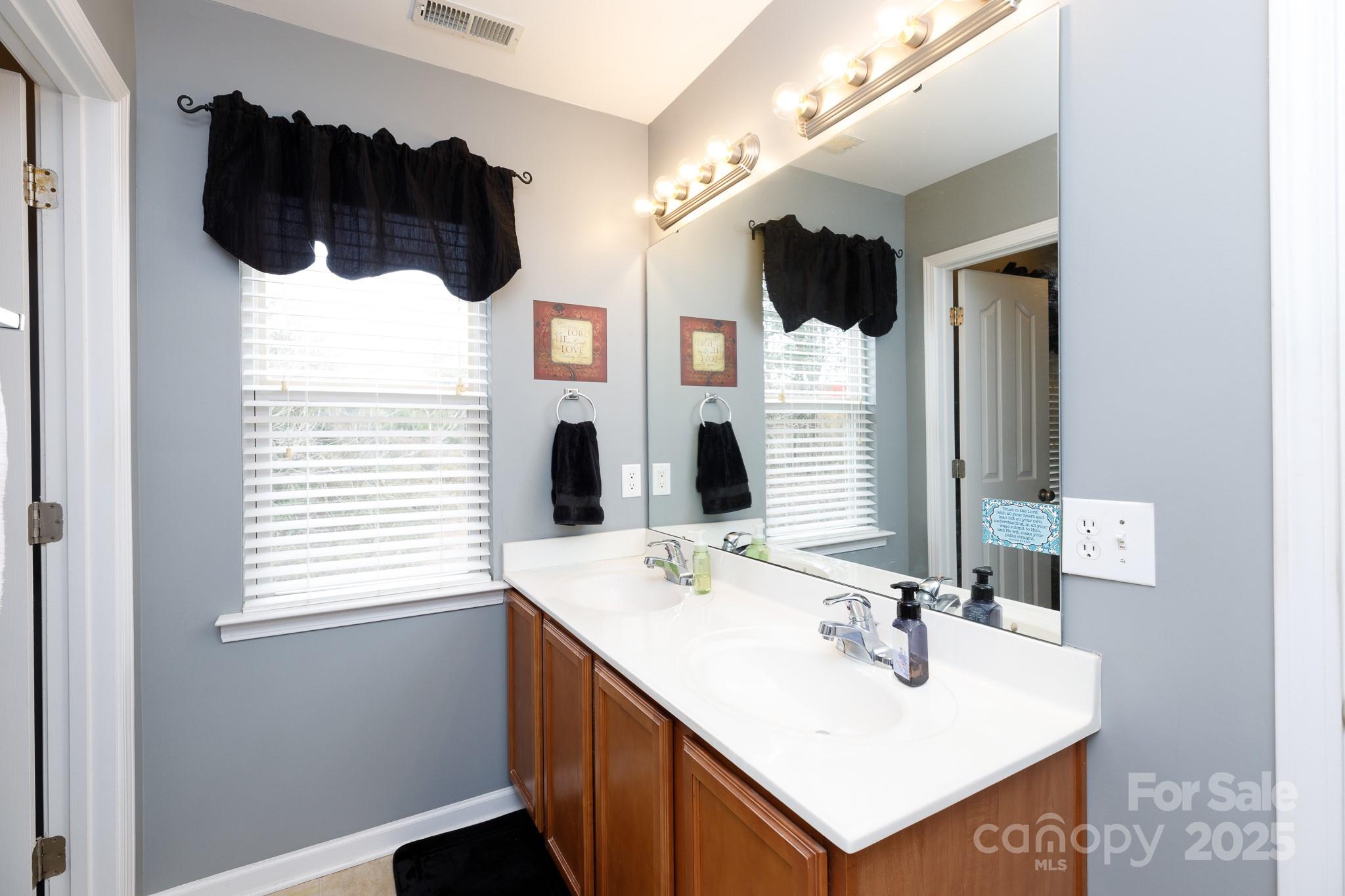 722 Chelton Lane Fort Mill, SC 29715 - Photo 15 of 19 a bathroom with a sink vanity and mirror