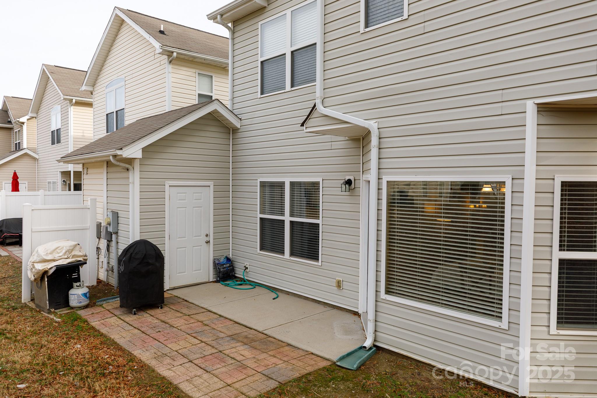 722 Chelton Lane Fort Mill, SC 29715 - Photo 18 of 19 a view of a house with a yard and furniture