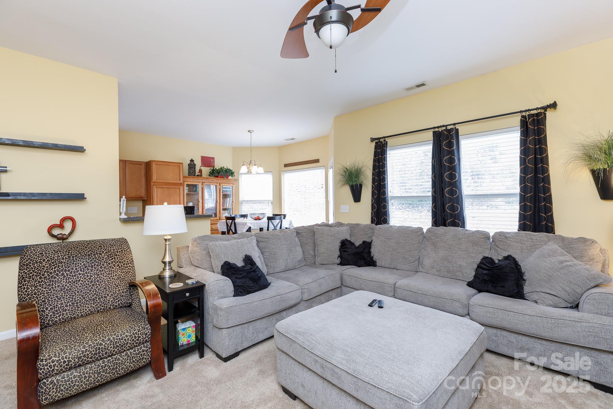 722 Chelton Lane Fort Mill, SC 29715 - Photo 6 of 19 a living room with furniture and a large window