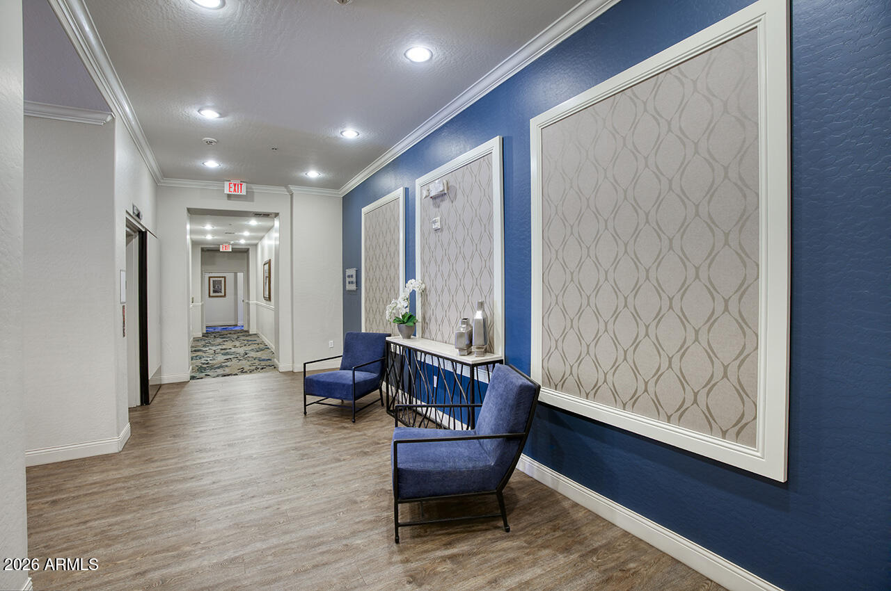 2989 North 44th Street, Unit 1024 Phoenix, AZ 85018 - Photo 1 of 16 a living room with furniture and wooden floor