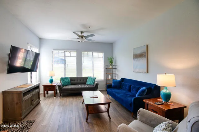 a living room with furniture and a flat screen tv
