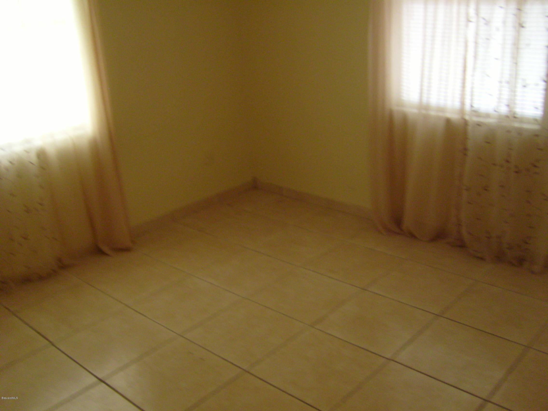 1474 Meadowbrook Road Northeast, Unit NE Palm Bay, FL 32905 - Photo 14 of 24 a view of room and window