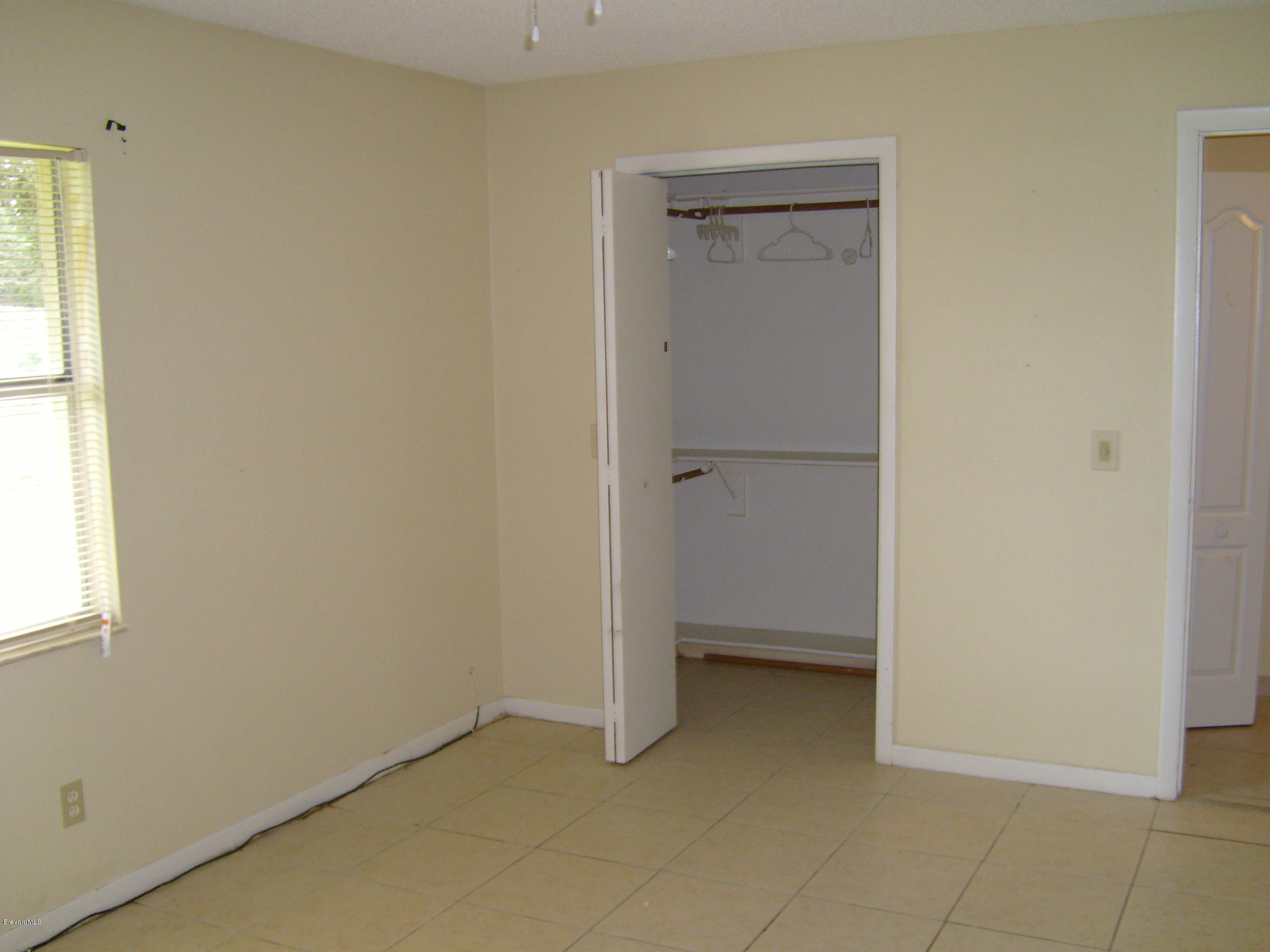 1474 Meadowbrook Road Northeast, Unit NE Palm Bay, FL 32905 - Photo 15 of 24 a view of an empty room