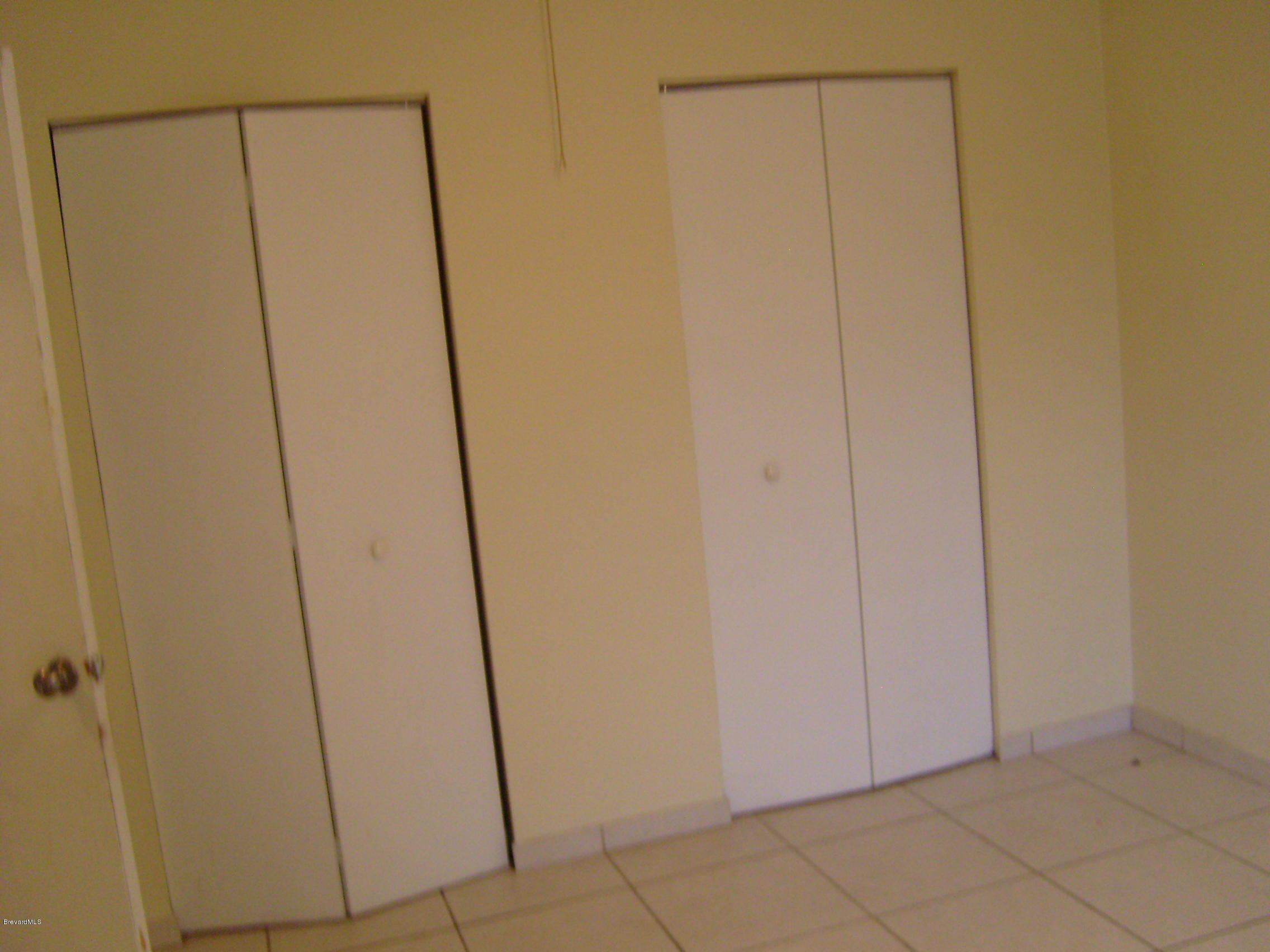 1474 Meadowbrook Road Northeast, Unit NE Palm Bay, FL 32905 - Photo 19 of 24 a view of an empty room