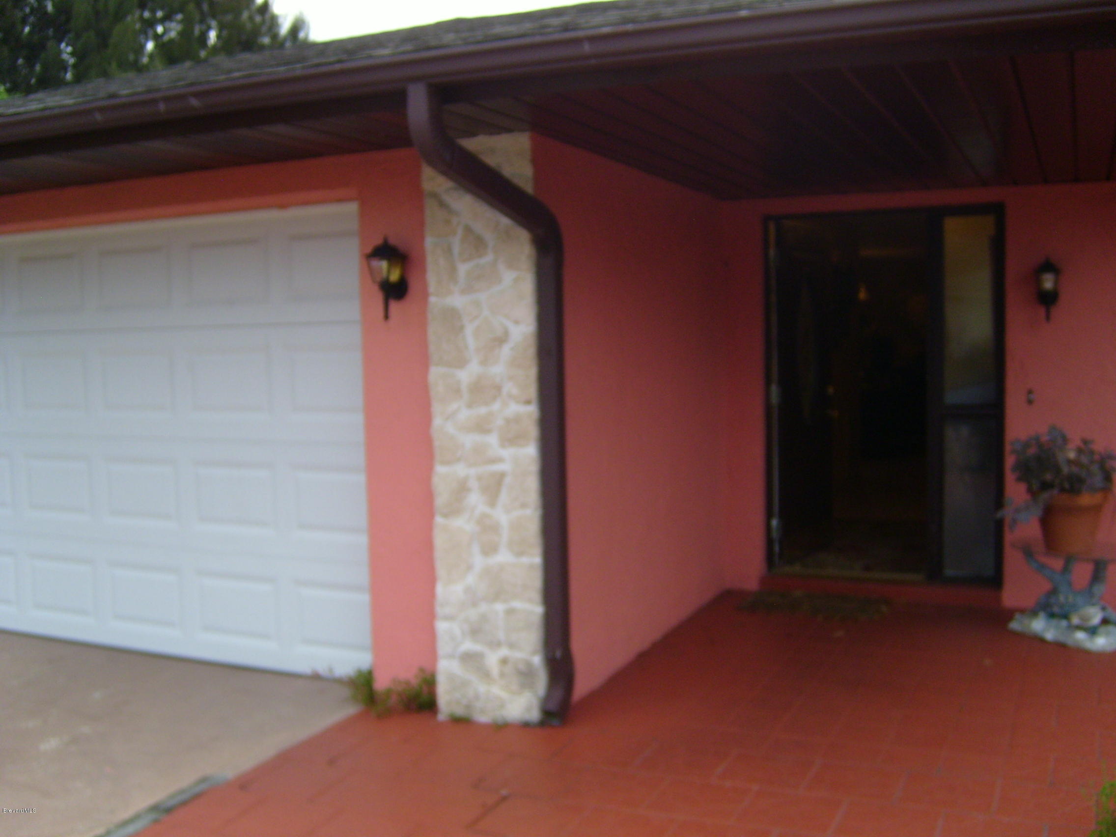 1474 Meadowbrook Road Northeast, Unit NE Palm Bay, FL 32905 - Photo 3 of 24 a view of wooden door