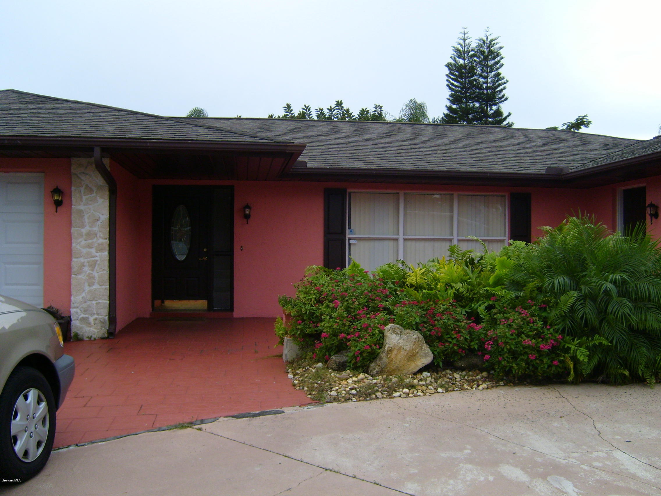 1474 Meadowbrook Road Northeast, Unit NE Palm Bay, FL 32905 - Photo 23 of 24 a front view of a house