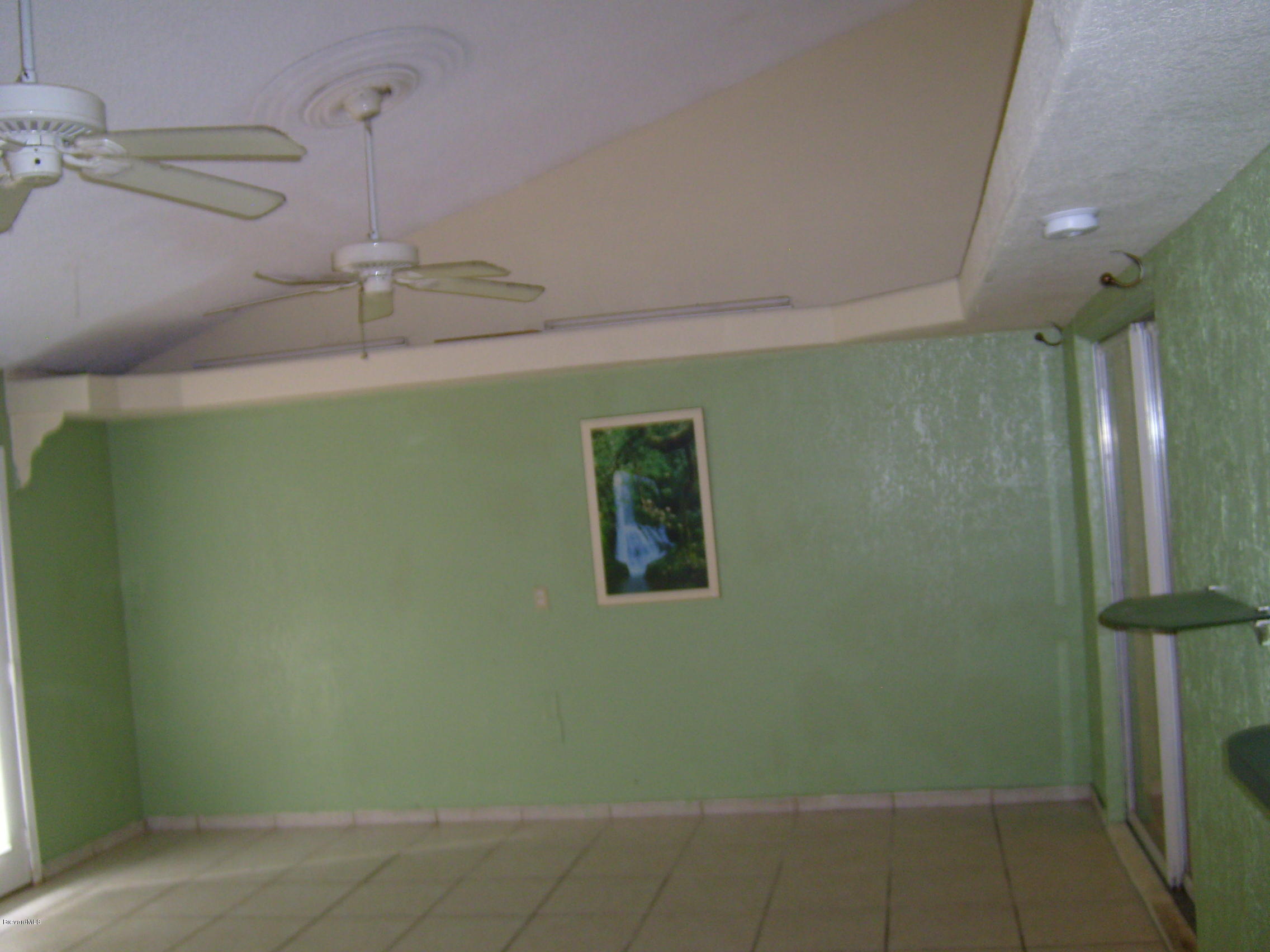 1474 Meadowbrook Road Northeast, Unit NE Palm Bay, FL 32905 - Photo 10 of 24 a view of a room with a shower