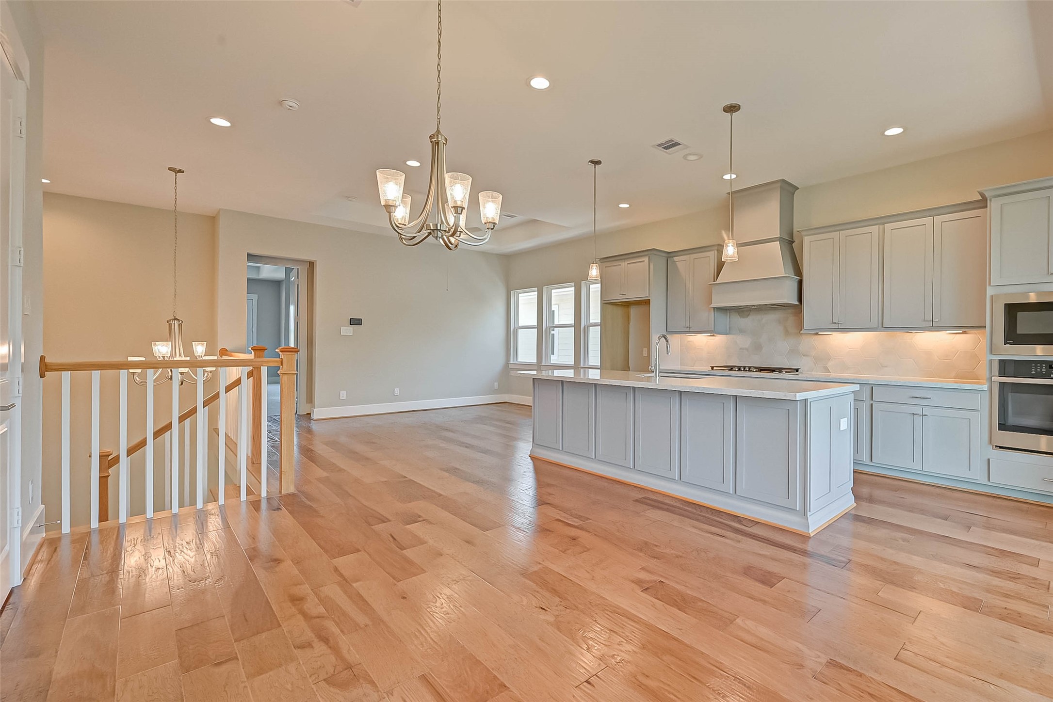 67 Thorpe Lane Spring, TX 77389 - Photo 11 of 27 a view of a kitchen with a sink and wooden floor