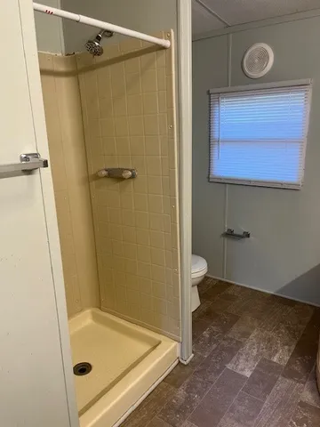 a bathroom with a tub and a shower