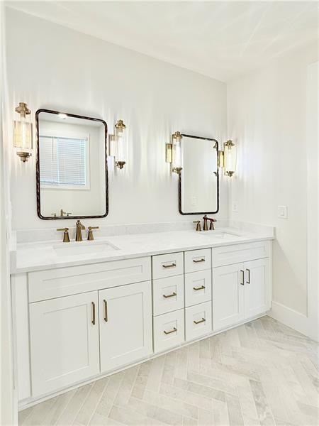 122 Palisade Drive Rydal, GA 30171 - Photo 33 of 54 a bathroom with double sink and a mirror
