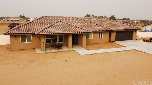 a front view of a house with a patio