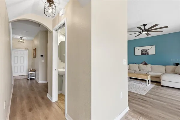 a spacious bathroom with a granite countertop sink a toilet and a mirror