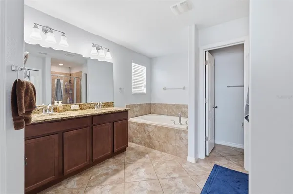 a bedroom with a bed furniture and window