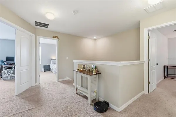 a view of a chairs and table in the patio