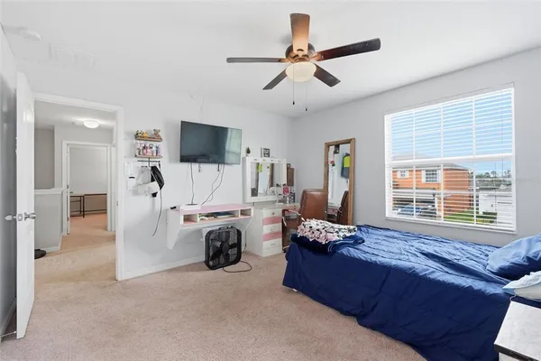 a view of a house with a yard and tree s