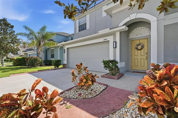 a view of a livingroom with wooden floor and stairs