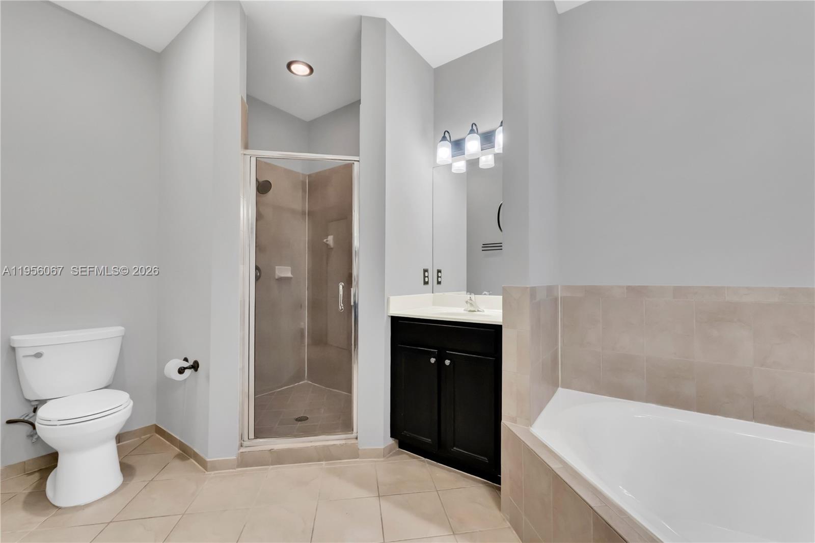 3401 Southeast 5th Street Homestead, FL 33033 - Photo 14 of 32 a bathroom with a double vanity sink toilet and shower