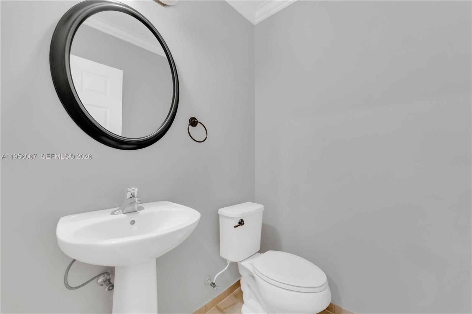 3401 Southeast 5th Street Homestead, FL 33033 - Photo 17 of 32 a bathroom with a sink and a mirror