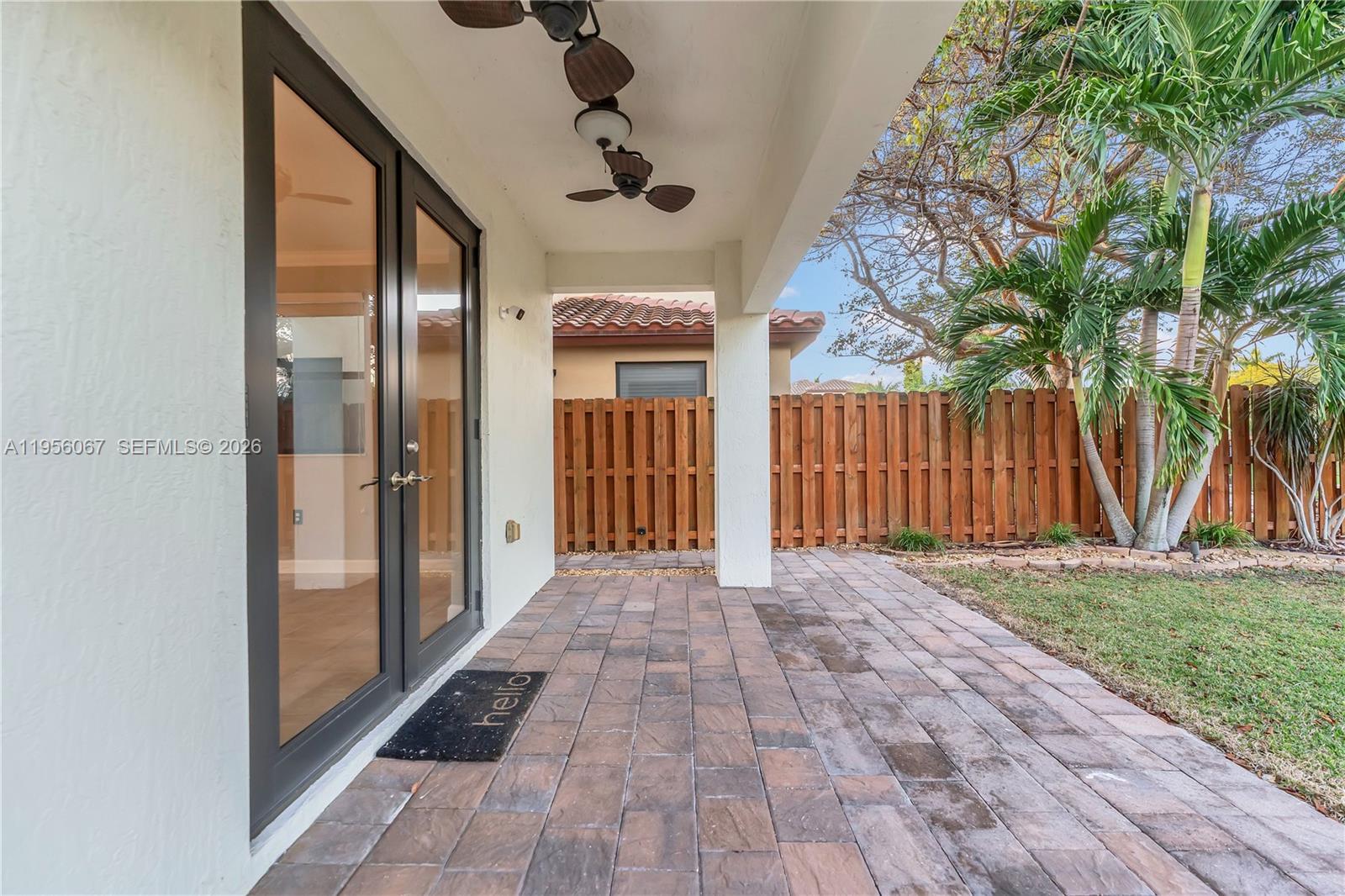 3401 Southeast 5th Street Homestead, FL 33033 - Photo 19 of 32 a view of a porch with wooden floor and fence