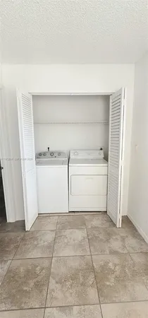 a view of a closet in a kitchen