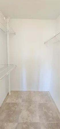 a view of an empty walk in closet