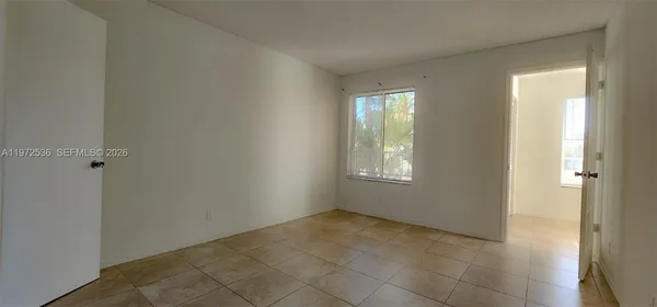 a view of an empty room and window