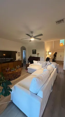 a view of wooden floor and windows in a room